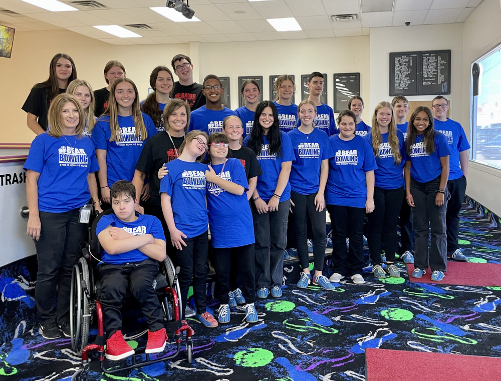 students and coaches of the unified bowling team pose for a picture